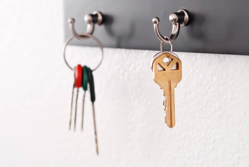 house keys on wall mounted key rack