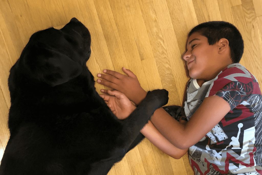kid and dog on floor